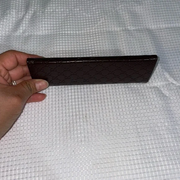 brown leather monogrammed foldable eyeglasses case from Gucci. - Picture 12 of 16